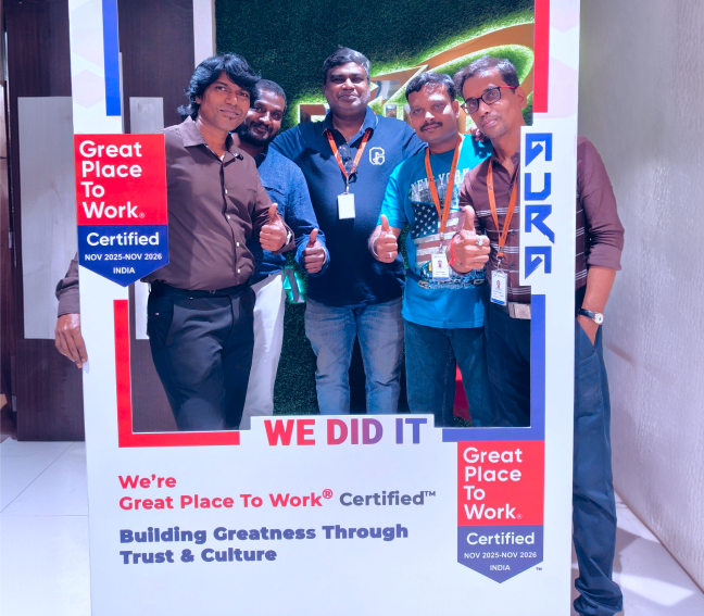 Three professionals working together in a modern office environment