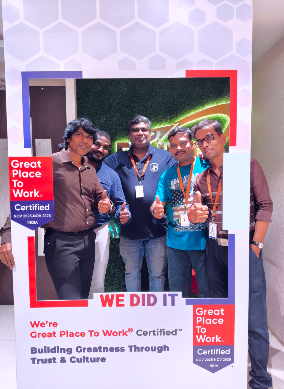 Three professionals working together in a modern office environment